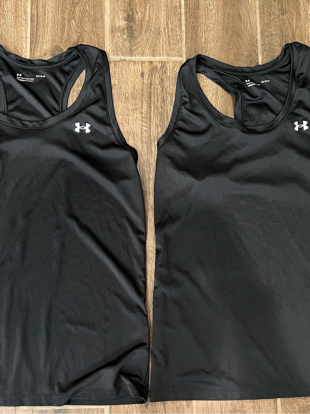 Under Armour Black Women’s Racerback One-Piece tank top. Women’s size L
